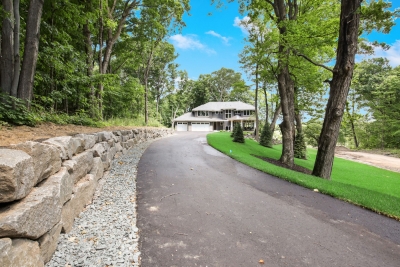 Long, private drive to this custom home in Plymout
